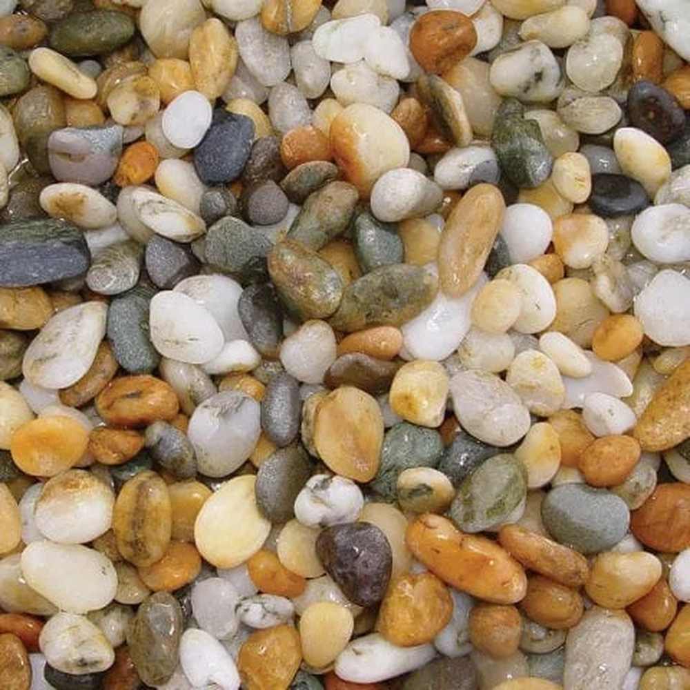 Close-up of smooth gold and multicolour pebbles from Aqua Natural