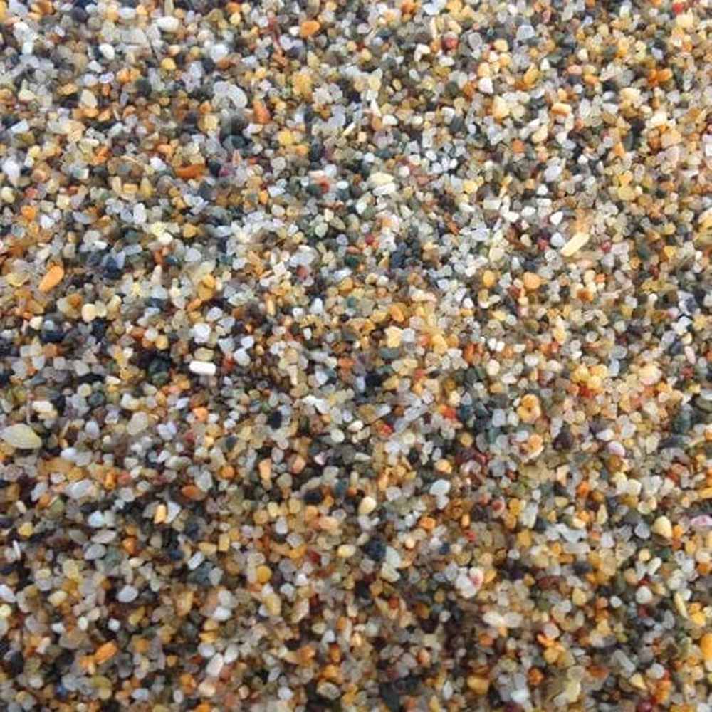 Close-up showing fine golden sand texture and natural grain size