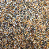 Close-up showing fine golden sand texture and natural grain size