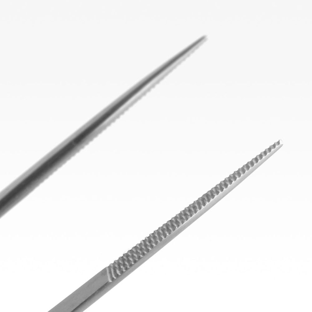 Close-up of needle-fine 1 mm tip on stainless steel forceps
