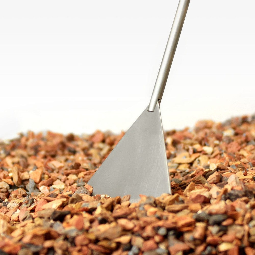 Aquascaper using Aquavitro Soil Spade to level substrate in aquarium
