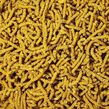 Yellow shrimp food pellets made from bee pollen and pumpkin